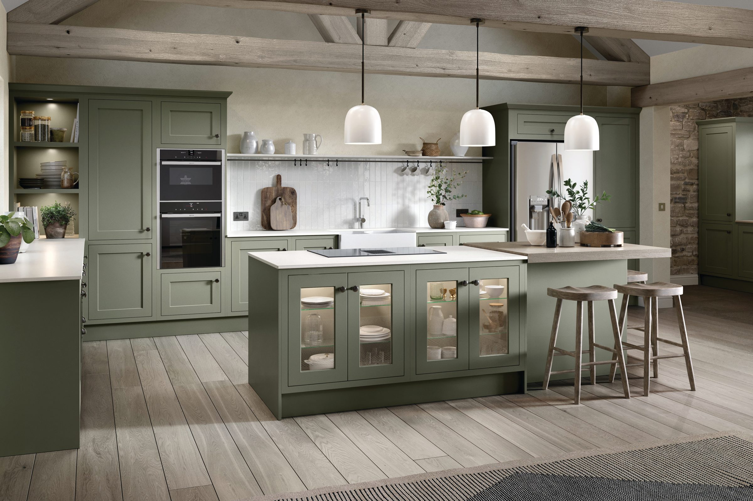 Sage green shaker kitchen with a glazed island